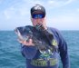 6-12 - Joe shows off a 2.5 lb. sea bass, part of a double-header keeper catch.